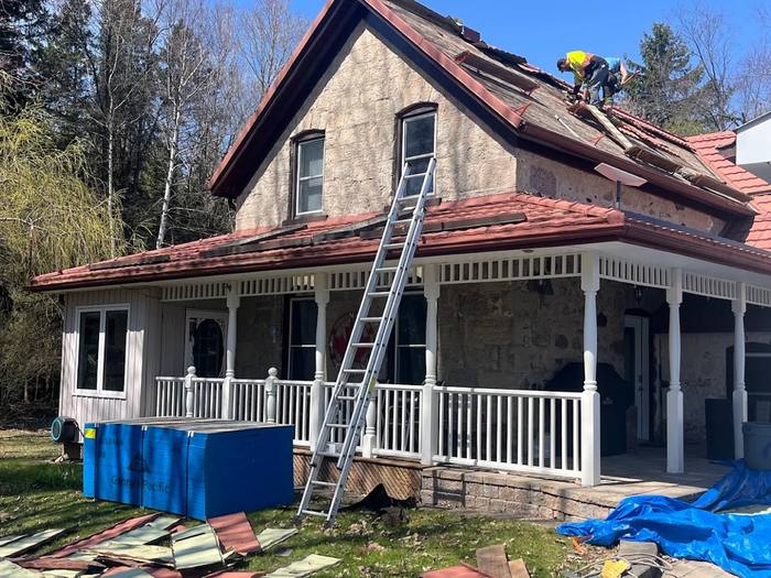Specialty roofing work by Testarossa Roofing showing cedar and steel roof surfaces